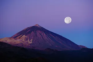Full moon over Teide volcano (3, 718m) at sunrise, Teide National Park, Tenerife Full moon over Teide volcano (3, 718m) at sunrise, Teide National Park, Tenerife